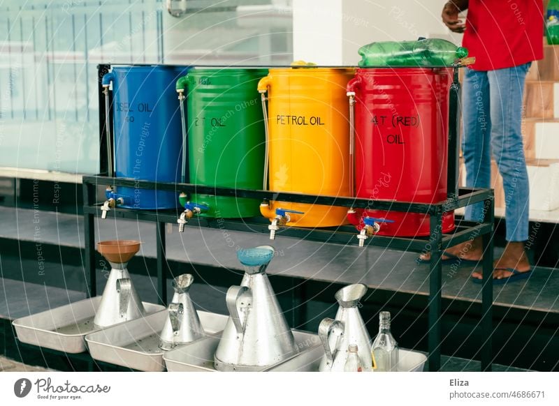 Colorful fuel tanks at a gas station in Sri Lanka Fuel Gasoline Petrol station Diesel bins Canister Refuel Oil Raw materials and fuels variegated Asia