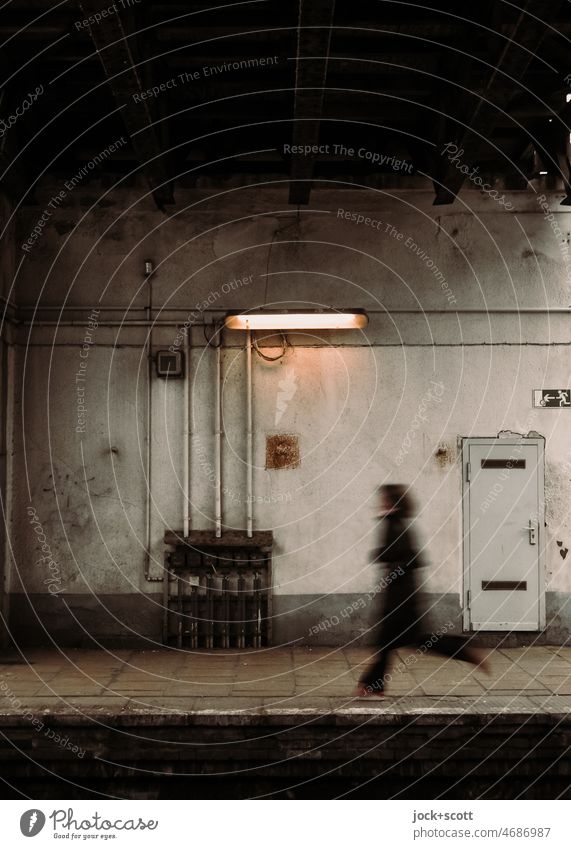 walk along the S-Bahn platform in the direction of the exit Ostkreuz Berlin Platform Signage Past Nostalgia Lanes & trails Lighting Silhouette motion blur