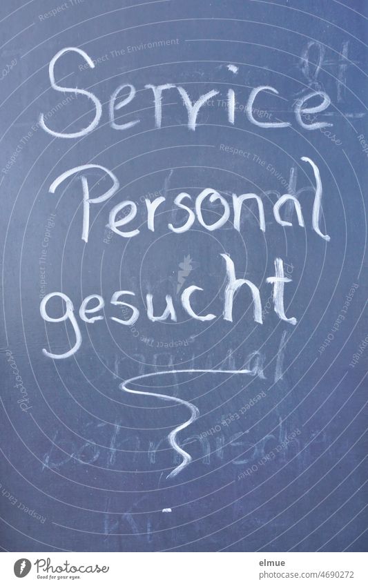 Service personnel wanted - written in white on the slate of a gastronomic establishment previously used as a menu card / shortage of personnel / job offer