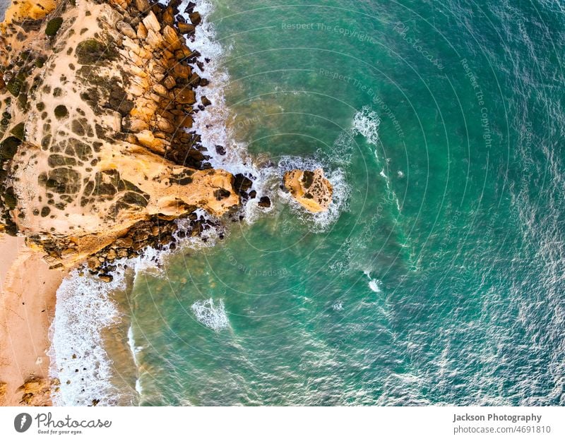 Cliffs on Sao Rafael beach by the Atlantic Ocean at sunset, Algarve, Portugal algarve sao rafael cliffs portugal albufeira aerial algarve region atlantic