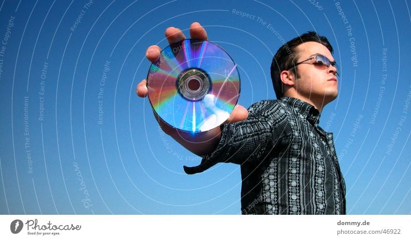 cdman Man Stand Eyeglasses Shirt Round Reflection Summer CD dommy Thomas Looking Data storage Music Silver Blue Sky Sun Open Advertising