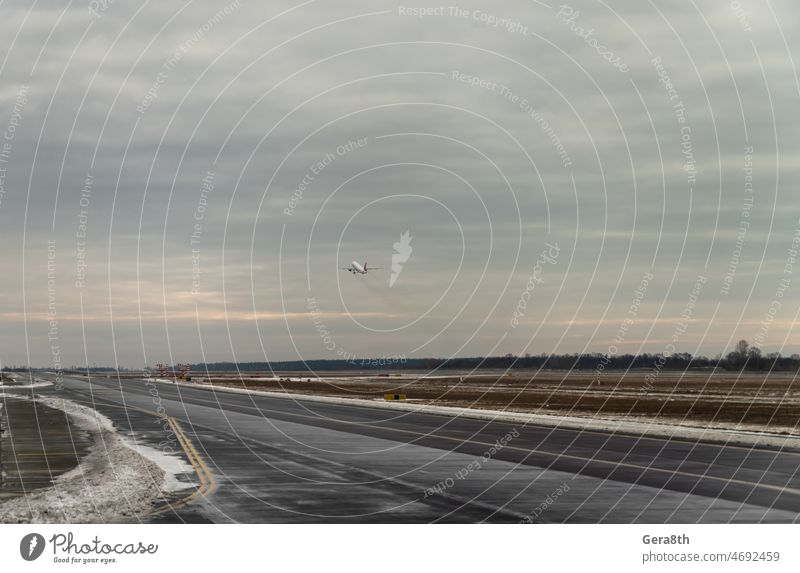 plane takes off from the airport in Ukraine Boryspil February Kiev aeroplane airplane airplane wing blue crisis dramatic empty airport flight fly fly away