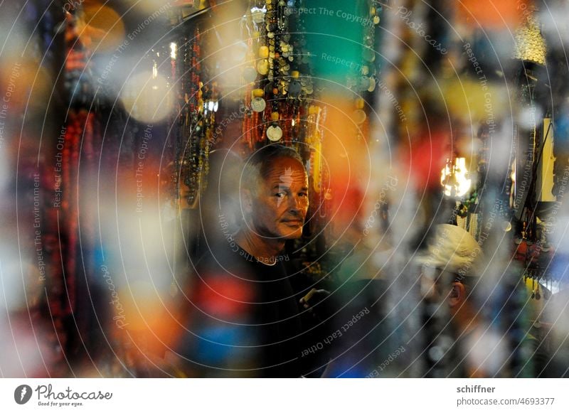 Man in a store from the front Store premises Magazine Shallow depth of field variegated