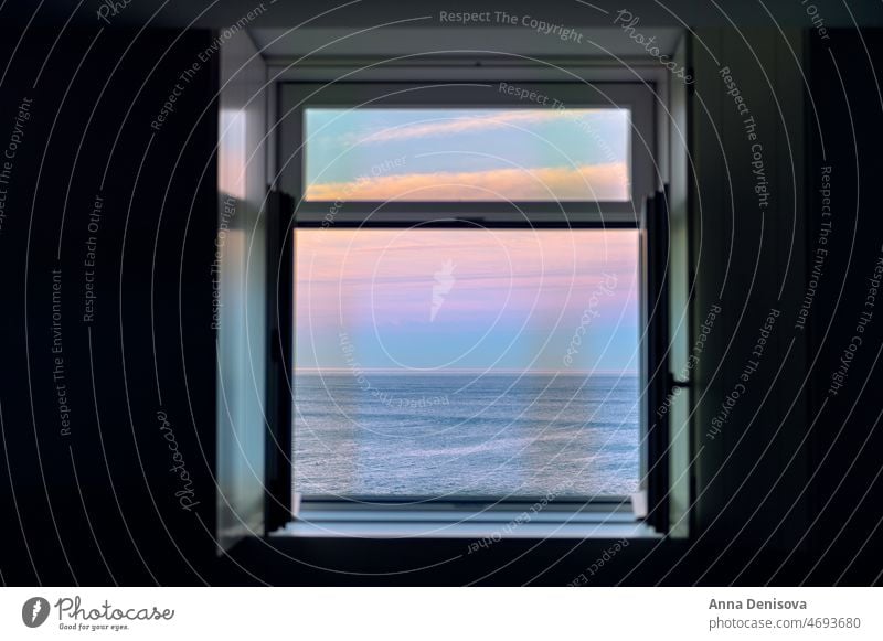 Sunrise over Atlantic Ocean through the open window ocean atlantic sunrise beach atlantic ocean wave porto pink house apartment morning portugal europe