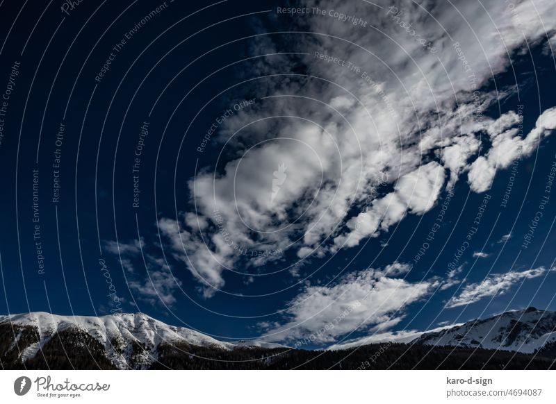 High mountain sky Sky Clouds Exterior shot Day Colour photo Deserted Air Landscape Blue Snow mountains Engadine Switzerland timber line Winter Canton Graubünden