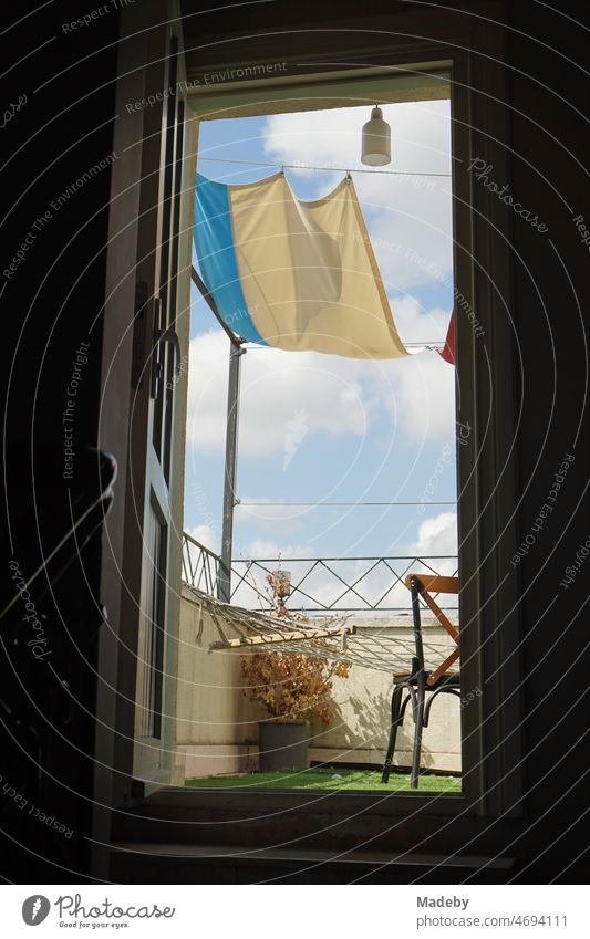 Staircase leading to the roof terrace of a hotel in summer sunshine in the alleys of the old town of Taksim on Istiklal Caddesi in the Beyoglu district of Istanbul on the Bosporus in Turkey