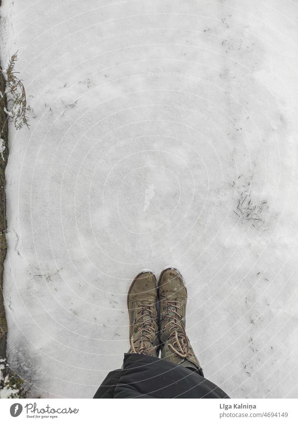 High angle view of boots and snow Snow Winter Snow layer Cold Virgin snow Snowscape Weather Frost White Winter's day Winter mood winter Seasons Boots Stand