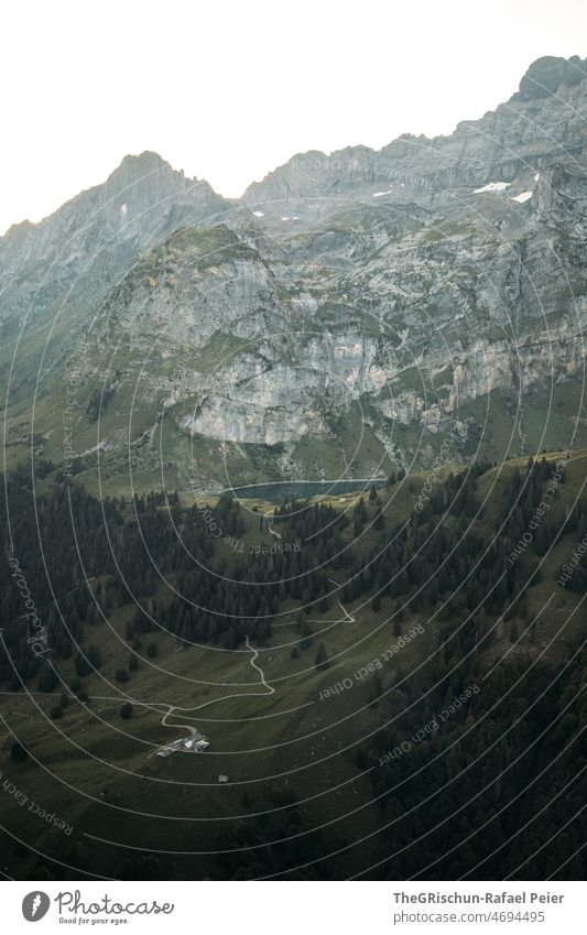 Alpine lake in front of mountains Mountain Lake alpine lake Glarus Upper Leadgi Lake from on high Forest Vantage point Panorama (View) Street