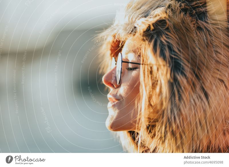 Woman in hat of fox fur woman head cap fluff style glasses portrait eyes closed female lady animal peaceful eyeglasses tranquil calm relax red hair rest natural