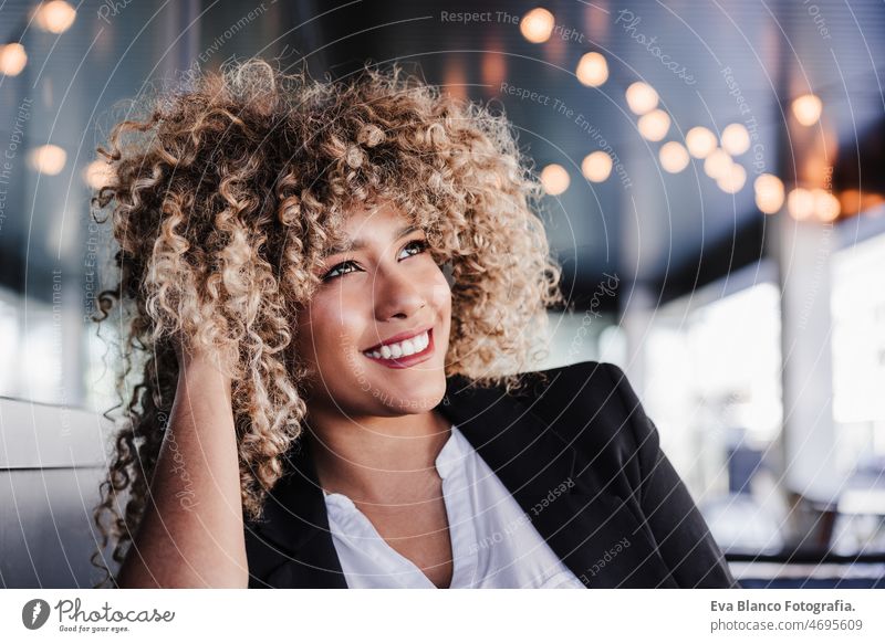 portrait of happy confident business woman in cafe. Business concept laptop computer afro working networking drinking coffee terrace outdoors goggles