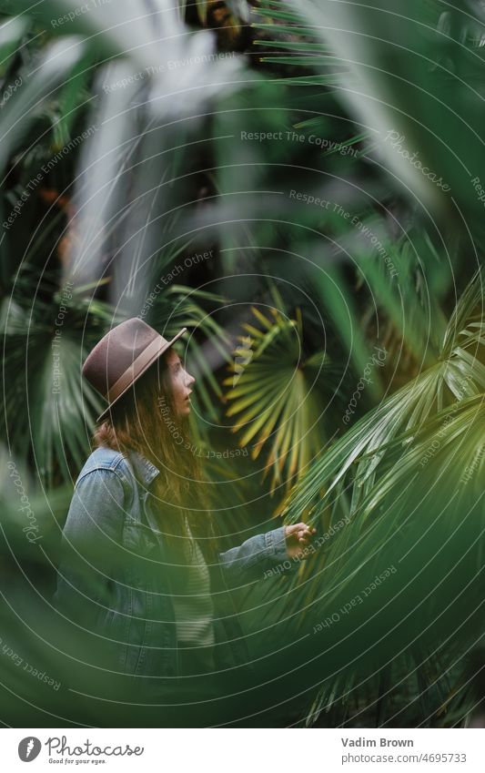 portrait of a girl in the jungle woman beauty people hair fashion person face model child looking summer lady one smiling beach palm tropical vacation nature