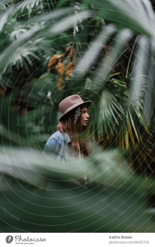 portrait of a girl in the jungle woman beauty people hair fashion person face model child looking summer lady one smiling beach palm tropical vacation nature