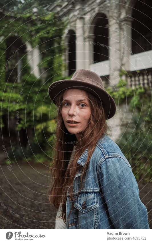 Portrait of a girl. Old palace with green plants. hat woman beauty fashion face hair smile model person people smiling summer cowboy cowgirl lady happiness