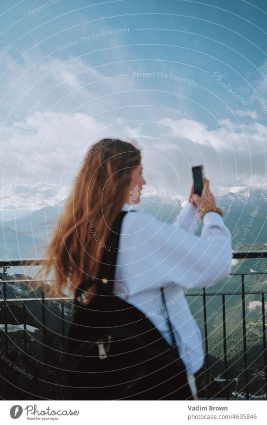 girl taking photo in the mountain woman phone beauty mobile people person smiling camera smile nature outdoors holding cellphone technology communication park