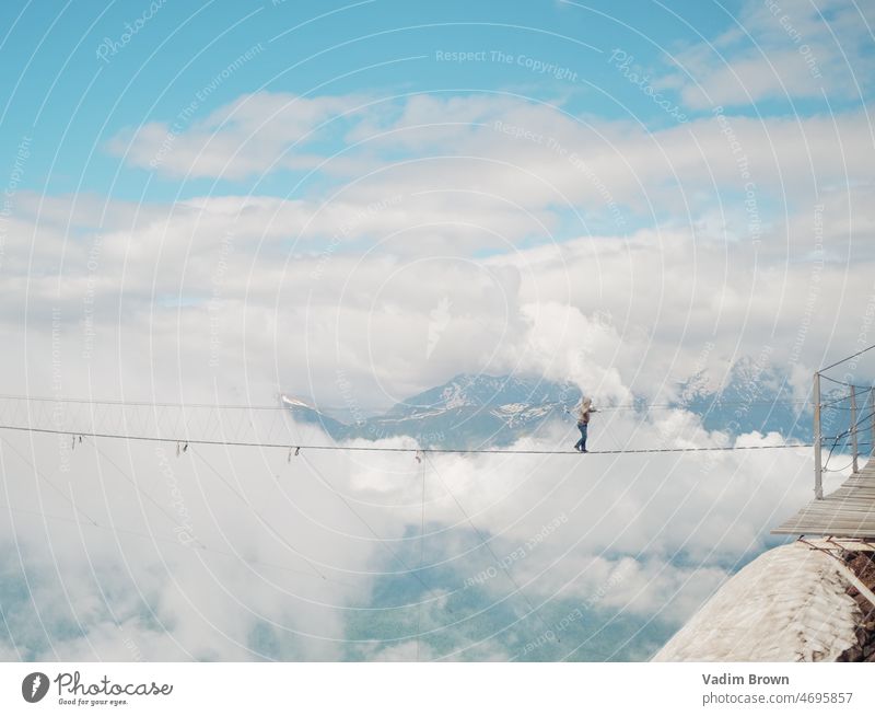 Extreme bridge in the sky. Adventure mountain landscape snow nature winter cloud alps clouds mountains travel peak glacier ski view rock cold ice water fog hill