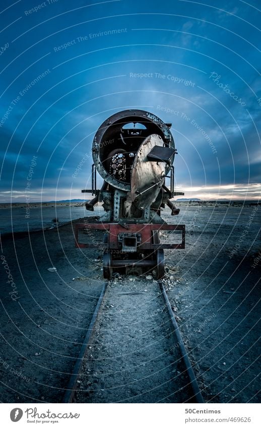 Train cemetery in Uyuni, Bolivia - The old Train - Old Lady Means of transport Logistics Rail transport Engines Metal Large Creepy Cold Broken Retro Blue Calm