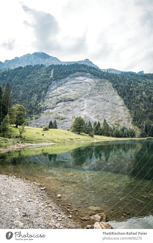 Lake before mountain Lake Obersee Glarus Water Tourism Switzerland Mountain Alps Landscape Exterior shot Blue Rock Hiking Deserted