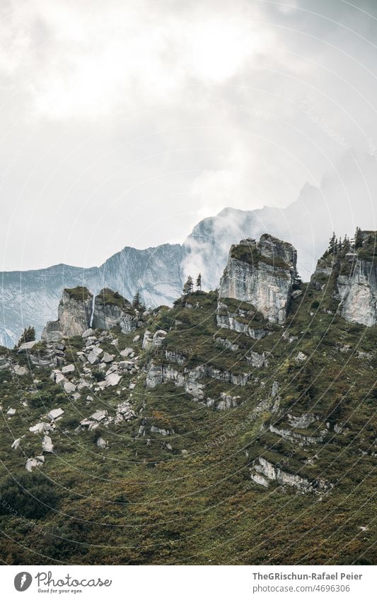 Rock formation in front of mountain hiking trail Alps Hiking Bergen Mountain Nature Landscape Exterior shot Tourism Wall of rock Peak Environment Colour photo