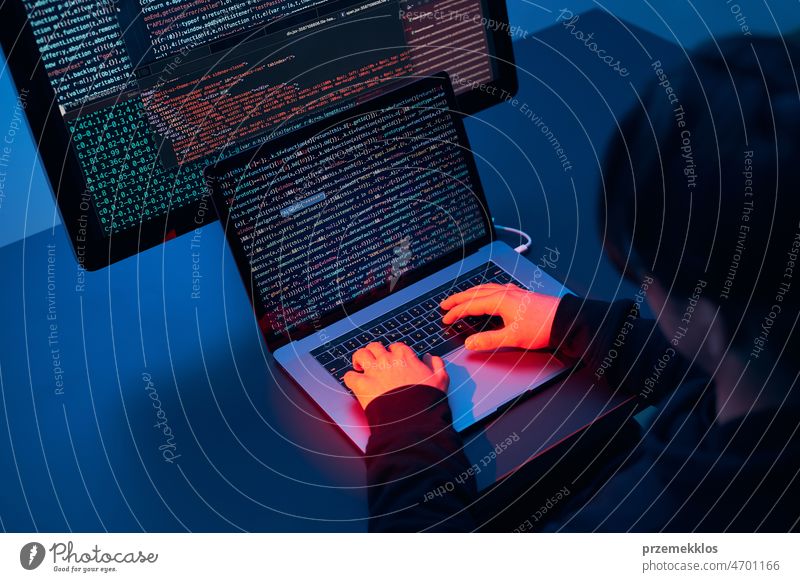 Man using computer and programming  to break code. Cyber security threat. Internet and network security. Stealing private information. Person using technology to steal password and private data