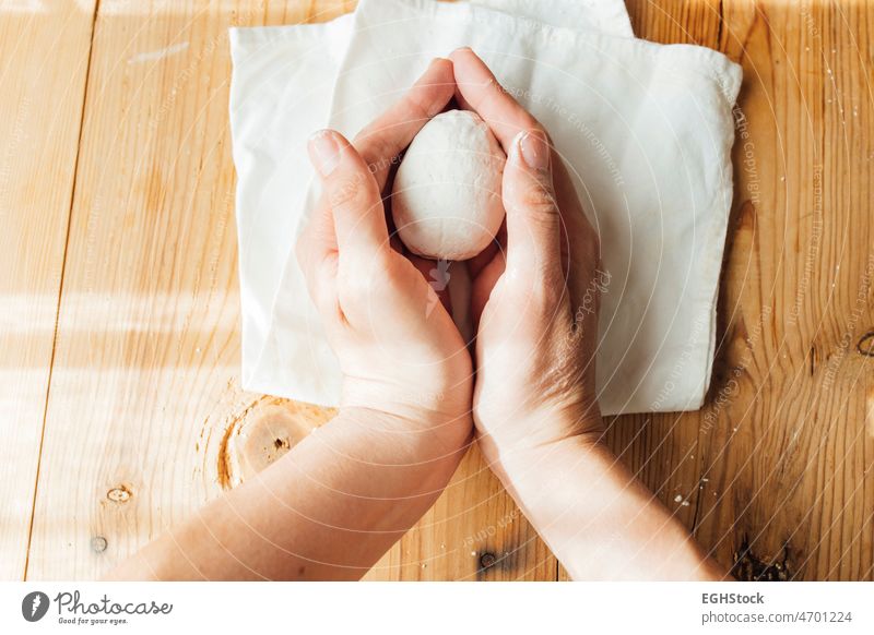 female hands holding a handmade ceramic egg for easter. Minimalist and diy concept. one people top view minimalist minimalism cement decoration spring toy