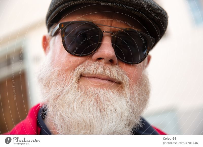 Older gentleman with a large full beard grey hair elderly people male man emotion expression grandfather mature headshot portrait white isolated mustache