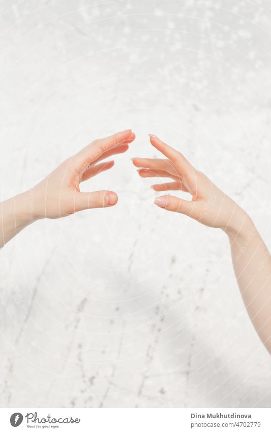 two female hands almost touching on neutral background, connection of two souls women woman young concept together holding adult Hand person love lifestyle girl