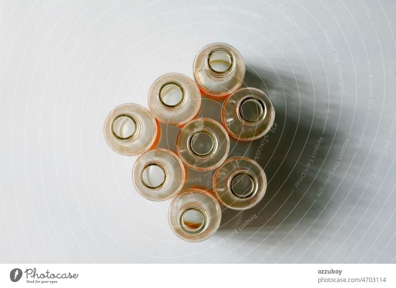 Close up used empty glass bottles group transparent drink closeup row clear nobody background many alcohol beer water fresh open recycle recycling alcoholic