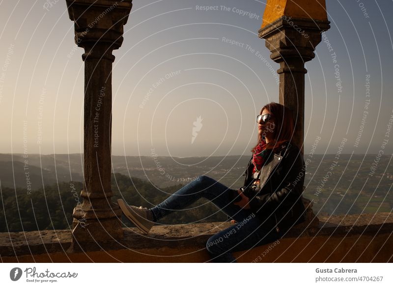 Relaxed woman with glasses, taking a break and contemplating the landscape. Woman Feminine Looking portrait Young woman Portrait photograph Landscape