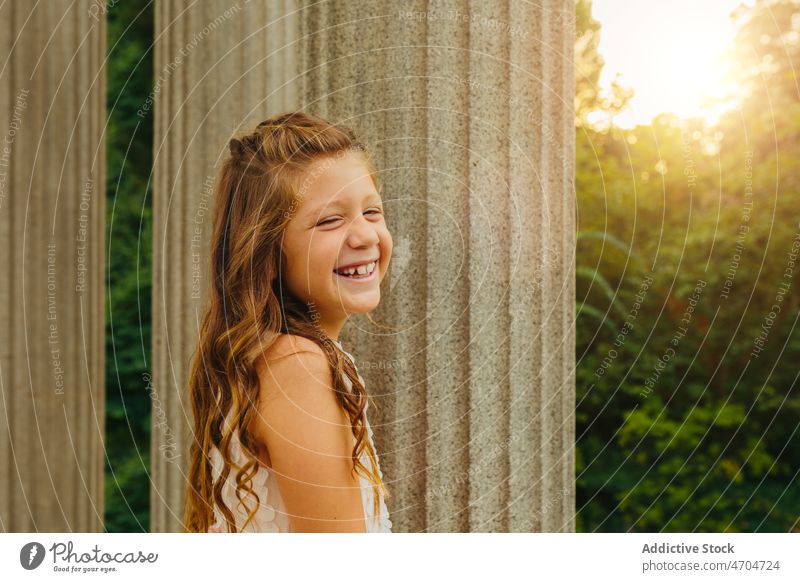 Happy young woman smiling and looking at camera summer female smile cheerful happy relax charming glad joy nature carefree rest long hair sunlight enjoy