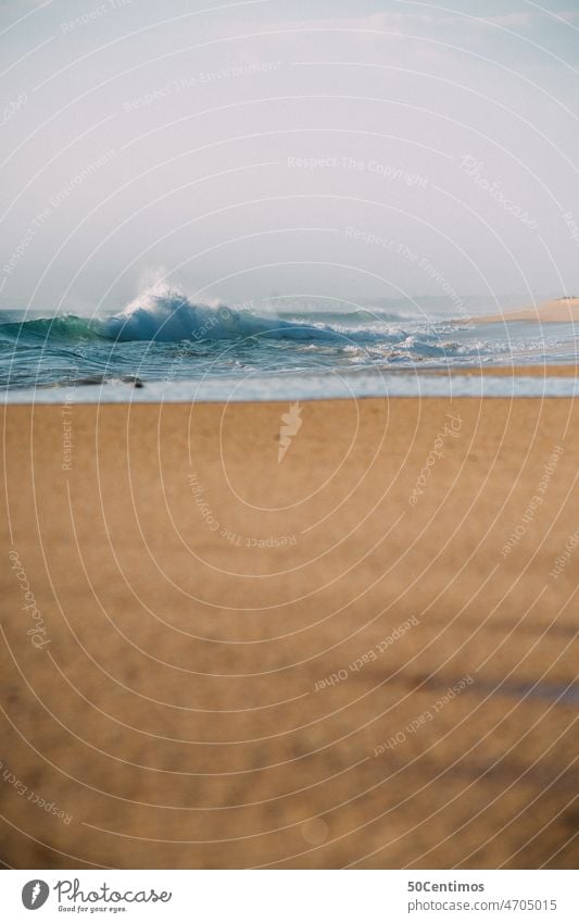 Waves on lonely beach Ocean Sand Beach Sky Day Portugal Algarve Europe coast Deserted tranquillity Beautiful weather Portrait format Clouds Fog Panorama (View)