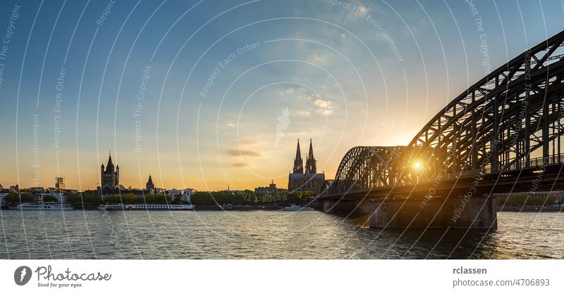 Hohenzollern Bridge and cologne cathedral at sunset Cologne city oldtown Rhine Germany river Carnival church bridge dusk gothik tourism night landmark