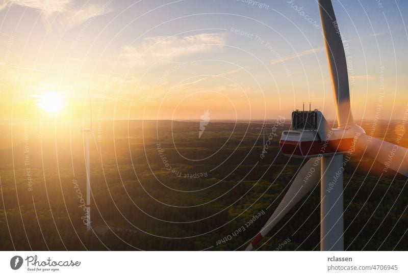 Beautiful sunset above the windmills on the field turbine scenic energy electricity farm rural silhouette agriculture alternative beautiful blue clean clear