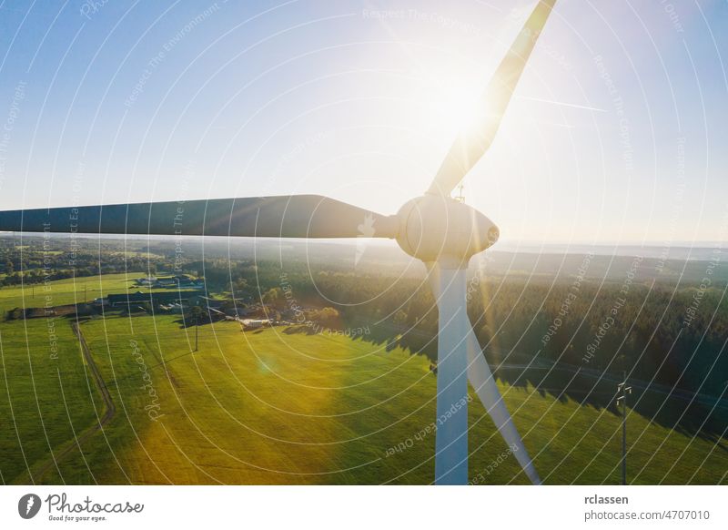 Wind turbines and agricultural fields on a summer day - Energy Production with clean and Renewable Energy - aerial shot wind energy power environment fuel