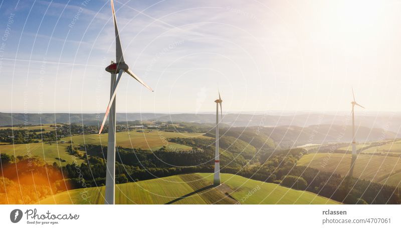 Wind turbine drone shot on a summer day - Energy Production with clean and Renewable Energy - aerial view wind energy power environment fuel alternative forest