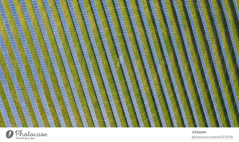 Top view of solar panels (solar cell) in solar farm .Photovoltaic plant field. Green Energy. drone power sustainable environmental energy sun wind ecosystem