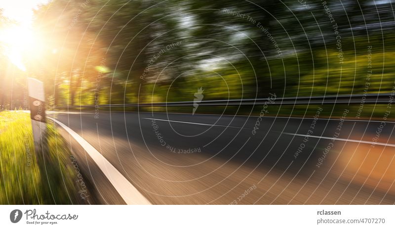 Long Curvy Forest Road In Alpine Mountains with motion blur, Backplate or Backdrop background. road mountain backdrop alpine race asphalt backplate beautiful