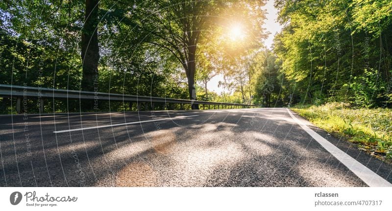 Long Curvy Forest Road In Alpine Mountains at summer road mountain highway empty sunrise sunset trip scenic landscape forest asphalt journey alpine alps austria