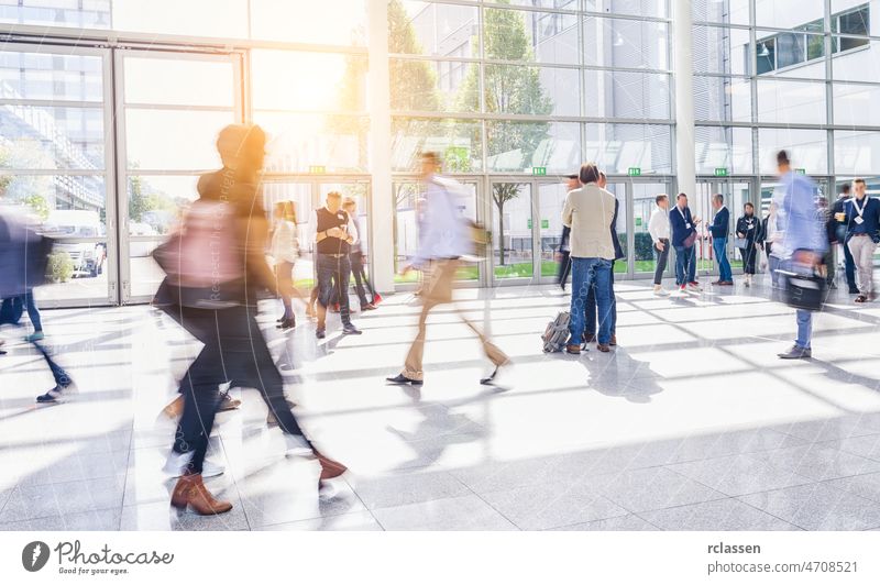 crowd of people walking at a trade fair street london group pedestrian anonymous rush blur mass concept germany seminar shopping frankfurt architecture blurred