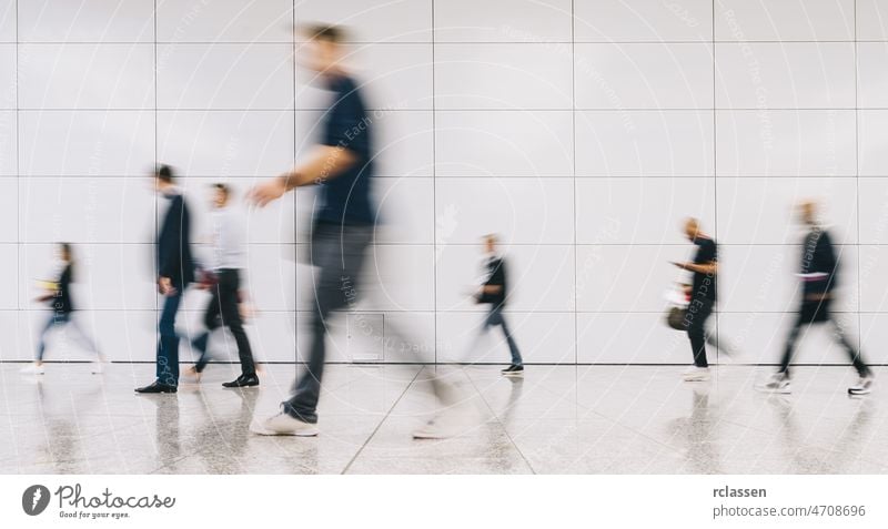 blurred business people at a trade fair crowd street london walking group pedestrian anonymous rush mass concept germany seminar shopping frankfurt architecture