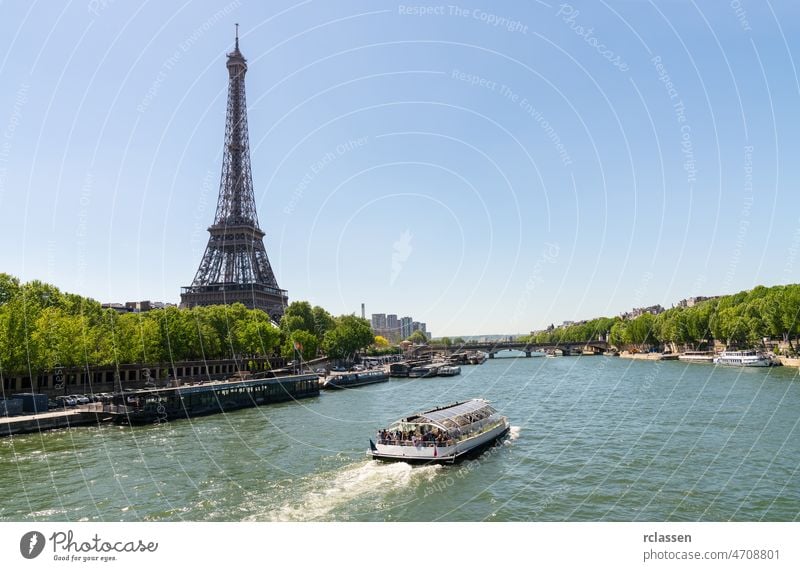 Paris Eiffel Tower and river Seine at summer in Paris, France. Eiffel Tower is one of the most iconic landmarks of Paris. copyspace for your individual text.