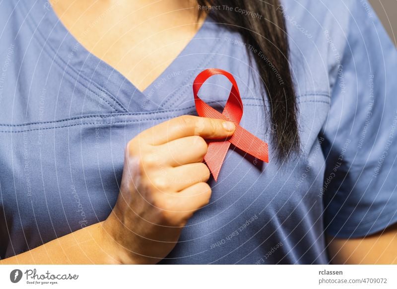 Doctor Hands Holding Pink Cancer Awareness Ribbon cancer breast mammography october pink background doctor oncology medical concept cure ribbon health care