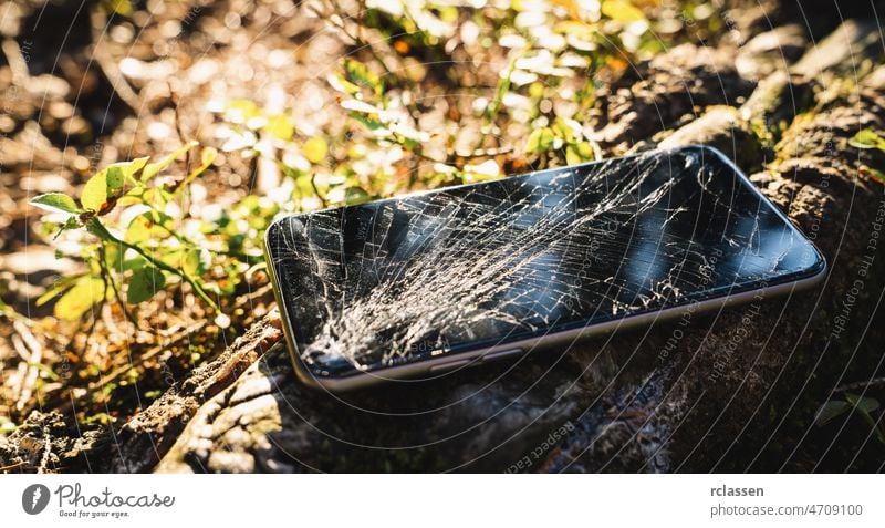 Broken screen smartphone outdoor after hiking broken hiker forest mobile display cellphone accident background black communication connection crack crushed