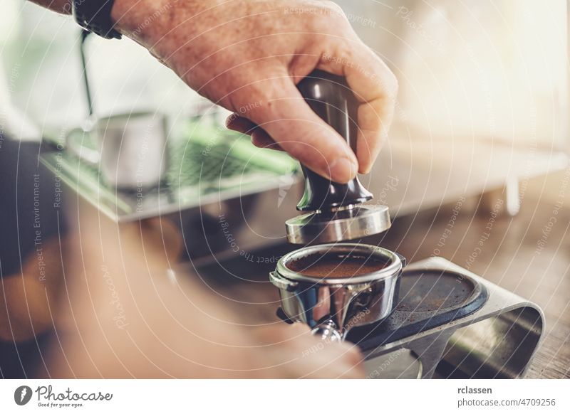 Coffee flour just pressed into filter holder by a Barista for fresh espresso coffee barista background beverage black business cafe powder portafilter cup drink