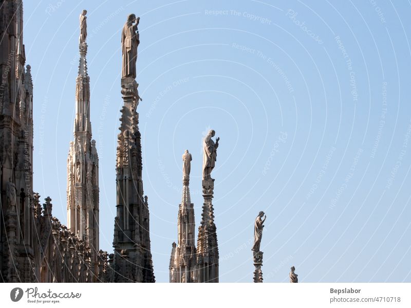 Statue on the spire Italy above architecture cathedral church commemorative faith high historic holiness holy isolated milano monument religion sculpt sculpture