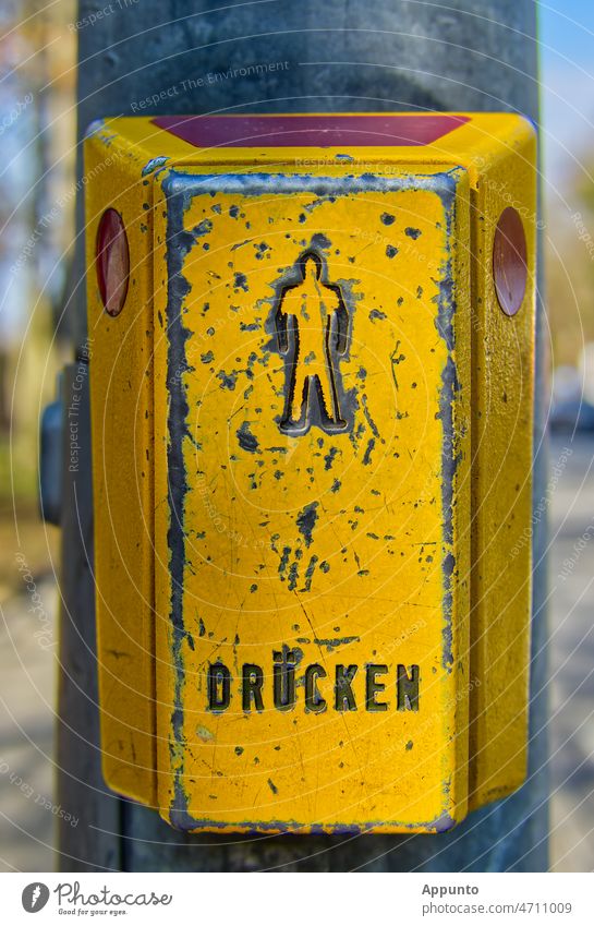 Yellow pushbutton at pedestrian traffic light "Press". Traffic light Pedestrian Crosswalk Street Safety Display Town Transport Key Priority Pushing