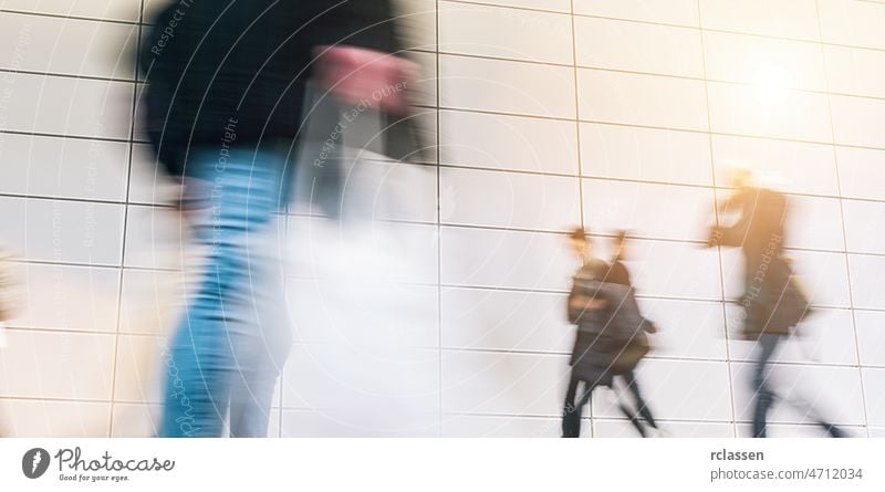 crowd of people walking on a trade show conference fair tradeshow hall expo business congress airport frankfurt travel mass seminar meeting future hostess blur