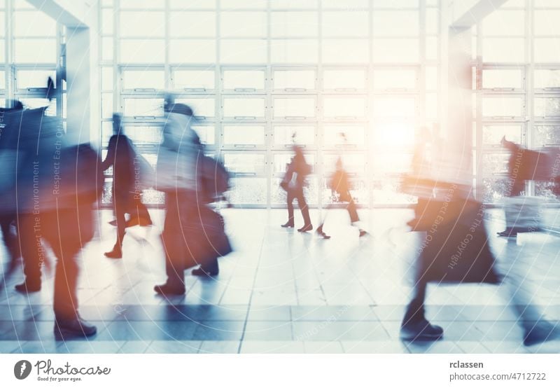 crowd of Blurred people walking trade fair show exhibition congress exit seminar visitors cologne travel future business hostess concept work corridor hall