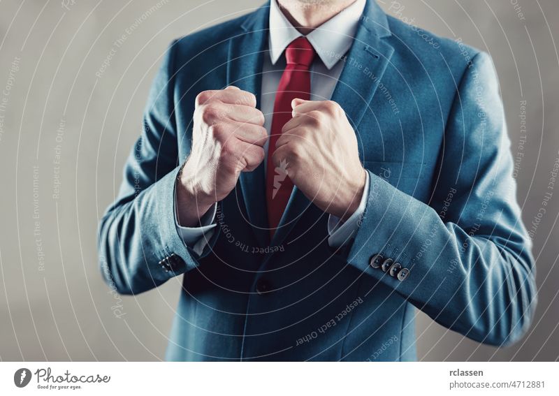 businessman raising fist and celebrating victory with hands - business gesture and people concept image teamwork creativity together brainstorming communication