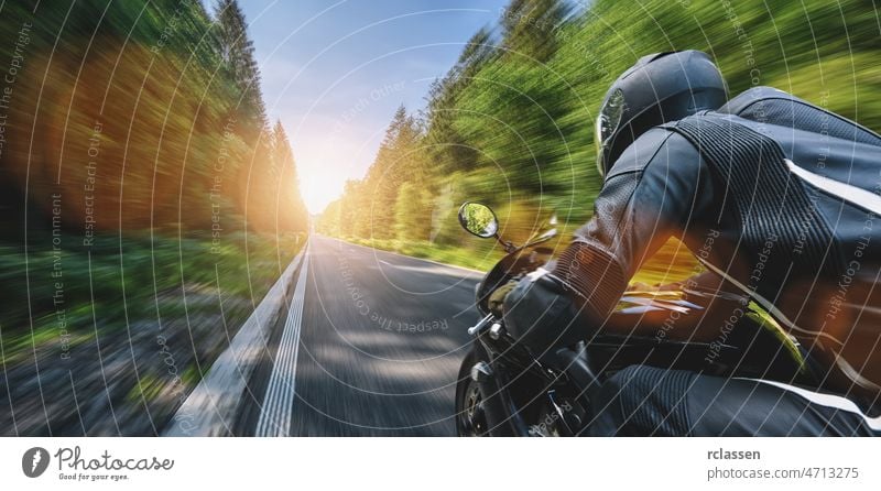 motorbike on the road driving fast. having fun on the empty highway on a motorcycle journey. outdoors ride street travel adventure asphalt background biker blue