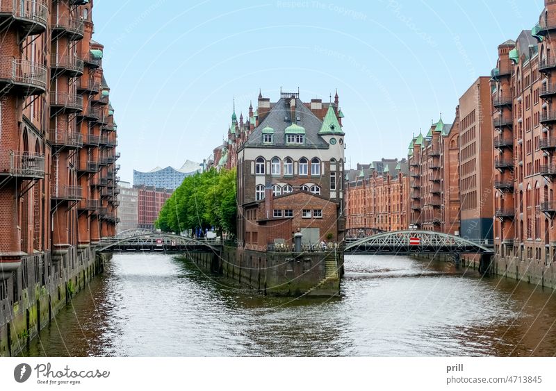 Speicherstadt in Hamburg storehouse city warehouse district Germany old historic Port City canal bridge facade House facade brick Brick wall port of hamburg